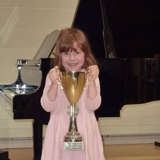 Naomi - the winner of the Grade 1-2 piano class at the Leamington Spa festival, 2009